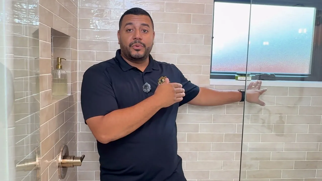 Mike Posada walking through a finished two-bathroom remodel in Dr. Phillips, Orlando