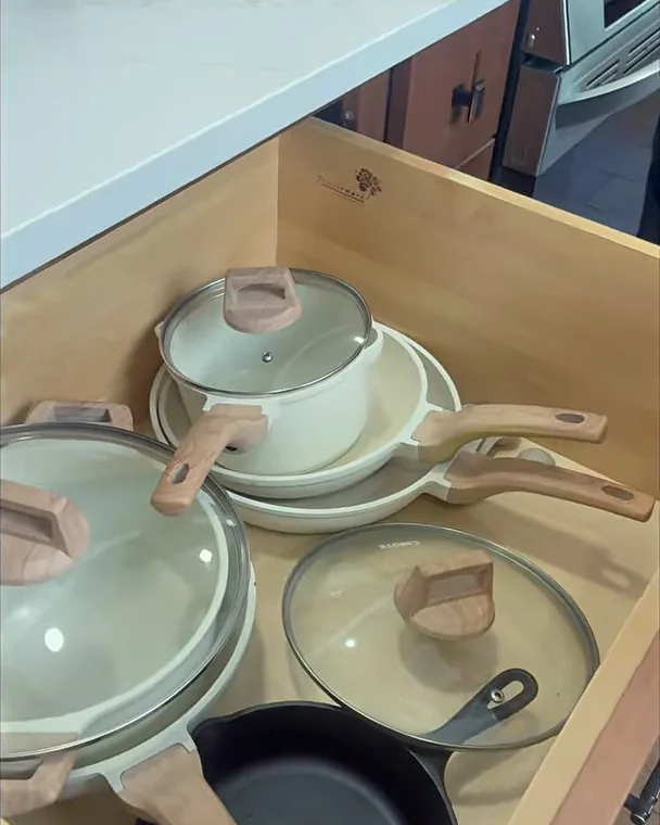 Deep soft-close drawer for pots and pans beside the range in a Winter Garden, FL kitchen remodel