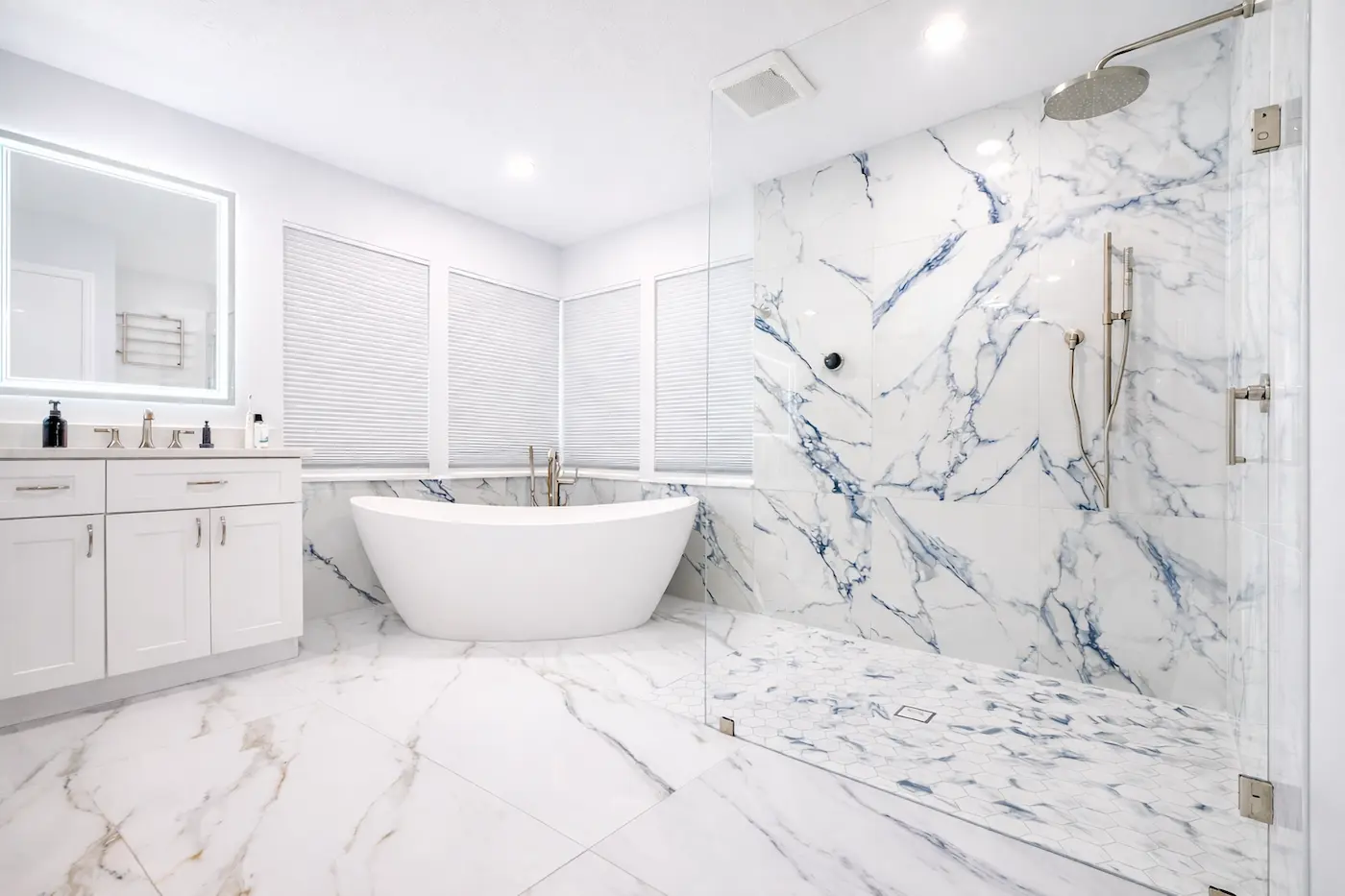 Luxury bathroom remodel with freestanding tub and marble walk-in shower