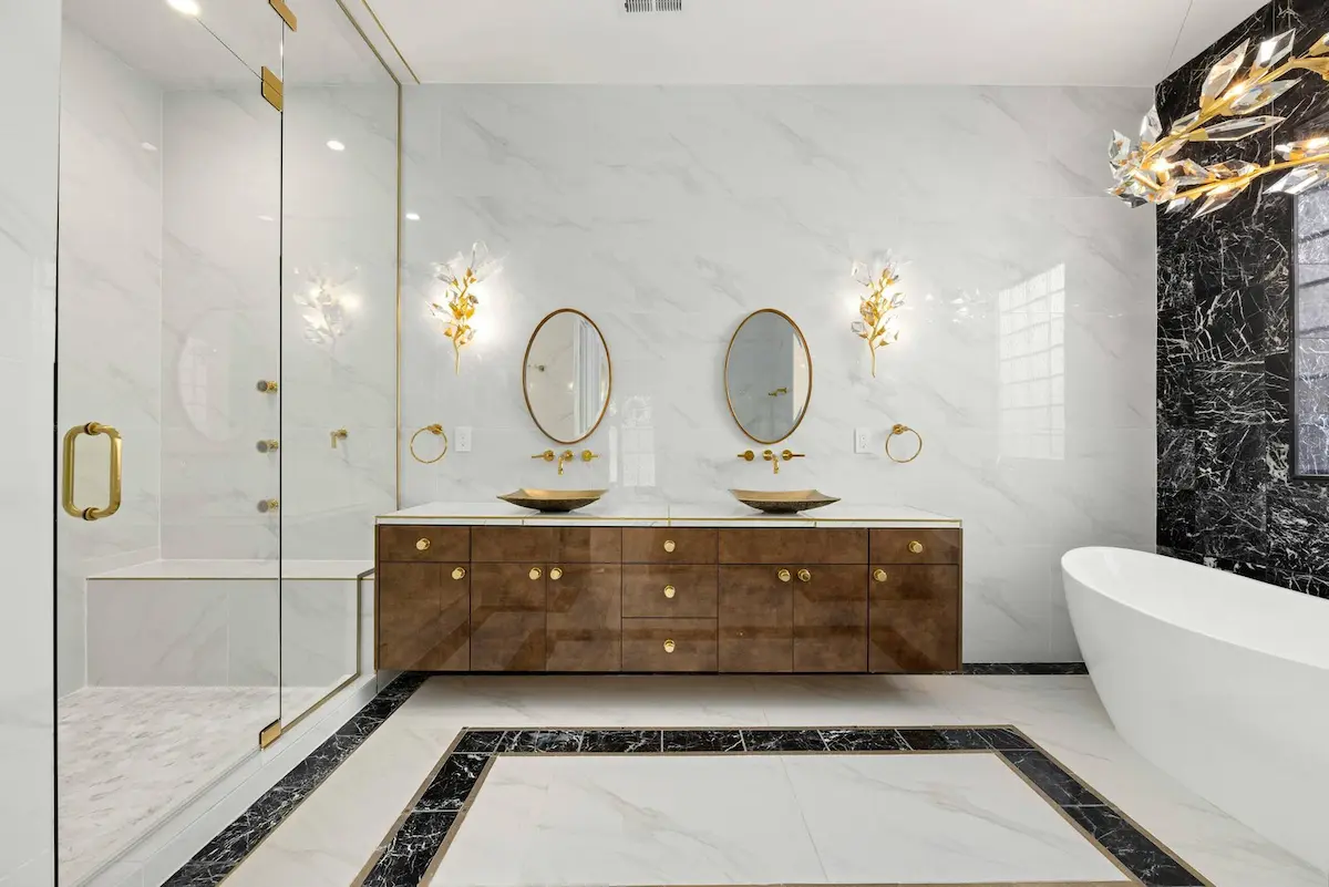 luxury bathroom remodel with marble tile and freestanding tub in lake mary florida