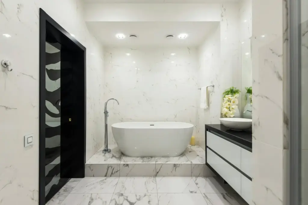 luxury bathroom remodel with freestanding tub and marble tile in lake mary florida